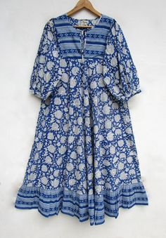 "ITEM DESCRIPTION blue dye printed long umbrella maxi dress - Henley neckline with cotton ties maxi dress - 3/4th sleeve with button maxi dress Features: 3/4th sleeve, Henley neck, Long dress Material: Cotton cambric Fabric: 100% cotton soft light weight ethnic print fabrics  Sleeve Length = 18 inch For more sizes & their measurement, please refer our below chart to understand the sizes variations available with us For your size requirement, please mention your size in seller note at the time of buying. SIZE MEASUREMENT  BUSTLENGTHSHOULDER XXS34 inch51 inch13.5 inch XS36 inch51 inch14 inch S38 inch51 inch14.5 inch M40 inch51 inch15 inch L42 inch51 inch16 inch XL44 inch51 inch16.5 inch 2XL46 inch51 inch17 inch 3XL48 inch51 inch18 inch   Company Return Policy:  Please write for more informat Blue Midi Dress With 3/4 Sleeve For Beach, Blue Maxi Dress With 3/4 Sleeve For Summer, Summer Blue Maxi Dress With 3/4 Sleeves, Long Batik Print Dress For Spring, Long Batik Print Spring Dress, Spring Cotton Maxi Dress With Batik Print, Summer Indigo Cotton Maxi Dress, Blue Cotton Floor-length Maxi Dress, Blue Cotton Maxi Dress Floor-length