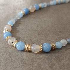 "Cute Light Blue Aquamarine Necklace Women ☆ Delivery in 1-4 working days! ☆ Arrives ready for gifting and usually ships same day or next day. The necklace will be sent with a gift! O T H E R ∙ I N F O R M A T I O N Blue Aquamarine size: 8 mm White Agate size: 8 mm Blue Aquamarine size: 6 mm Moonstone size: 5-6 mm Sodalite size: 3 mm **Intermediate apparatus and beads are non-tarnish gold plated. Length: The length shown on our models are 16\" and 18\" you may select 14-30\" from the drop down menu provided. If you want a size change, please contact us or leave us a message. :) ☆ Each of our necklaces at PEARLOWNJEWELRY are handmade and special natural stones. Necklace is made with positive energy. Each crystal is cleaned before shipment. We update the stock amount according to the custom Cheap Handmade Light Blue Necklace, Aquamarine Beaded Necklace, Healing Birthstone Necklaces With Round Beads, Light Blue Round Beads Necklace For Gifts, Healing Birthstone Necklace With Round Beads, Blue Crystal Necklaces With Gemstone Round Beads, Blue Single Strand Crystal Necklace Gift, Sapphire Beaded Necklaces With Gemstone Beads For Gift, Blue Beaded Necklace With Natural Stones