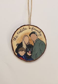 a family ornament hanging on a wall