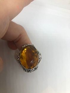 Large brilliant yellow antique glass Ornate German Silver NOT 925 Vintage ring, does not tarnish Size 7 My jeweler will re size for a $20 fee All rings are shipped free I. The US in a nice gift box. Check out our over a THOUSAND great reviews!!! Engraving is $4 per letter and is not always perfect depending on the piece. It can take a few days if the jeweler is busy. This is payable to Paypal Judithsltd@gmail.com Elegant Amber Ring With Large Stone, Yellow Oval Crystal Ring Gift, Antique Crystal Ring As Gift, Vintage Citrine Jewelry Gift, Classic Amber Rings For Gifts, Vintage Yellow Rings For Gift, Antique Amber Rings For Gifts, Antique Yellow Jewelry For Gifts, Antique Yellow Jewelry Gift