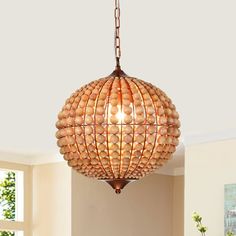 a light fixture hanging from the ceiling in a living room