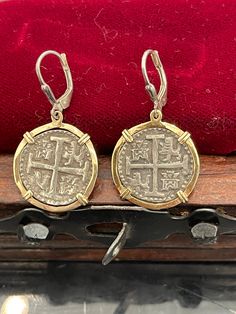 Atocha coin dangle earrings in 14kt solid gold bezel. These are absolutely beautiful earrings handmade from atocha silver bars and it comes with the certificate Silver Byzantine Jewelry In 14k Gold, Traditional Silver Earrings In 14k Gold, Nickel Free Coin-shaped Sterling Silver Earrings, Nickel-free Coin-shaped Sterling Silver Earrings, Nickel Free Coin Shaped Sterling Silver Earrings, Nickel Free Sterling Silver Coin Earrings, Nickel-free Sterling Silver Coin Earrings, Antique Round Engraved Earrings, Antique Engraved Round Earrings