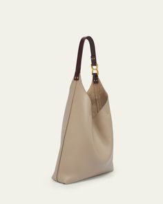 Chloe "Marcie" hobo bag in grained leather     Flat shoulder strap    Open top with center straps     Interior, one zip pocket     Approx. 9.1"H x 11.8"W x 3.5"D    Professional cleaning recommended    Made in Italy Calf Leather Tote Shoulder Bag With Gold-tone Hardware, Beige Pebbled Leather Shoulder Bag With Gold-tone Hardware, Everyday Calf Leather Satchel With Gold-tone Hardware, Textured Leather Hobo Shoulder Bag For Daily Use, Brown Pebbled Leather Hobo Bag For Everyday, Textured Leather Hobo Shoulder Bag For Work, Luxury Textured Leather Hobo Bag For Shopping, Leather Hobo Bag With Leather Lining For Work, Daily Use Textured Leather Hobo Shoulder Bag