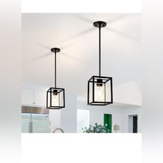 two square lights hanging from the ceiling in a room with white walls and flooring