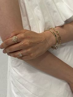 Gold Charm Bracelet Hand, Luxury Gold Hand Set Necklace, Luxury Hand Set Cuff Bracelet For Engagement, Luxury Hand-set Chain Bracelet For Weddings, Luxury Hand Set Crystal Bracelet, Luxury Delicate Bracelets, Luxury Delicate Tarnish-resistant Bracelet, Luxury Dainty Formal Bracelets, Luxury Hand Set Jewelry For Evening