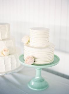 three tiered wedding cakes on a table