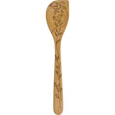 a wooden spoon with an etched design on the side and leaves on the outside, in front of a white background