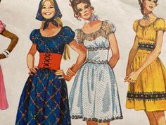 three women in dresses and bonnets are standing next to each other with their hands on their hips