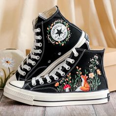 Custom Embroidered Converse High Tops 1970s, Fox Embroidered Converse Shoes, Fox and Flowers Embroidered Sneakers, Funny Halloween Gifts, Gift for Her 💚 Immerse yourself in the intricate craftsmanship as we lovingly hand embroider rustic flowers onto your chosen Converse pair 💚 🌿 The listed price encompasses both the Converse Shoes and the showcased Embroidery Designs. 1. MANUFACTURING PROCEDURE 🌿 Upon receiving your order, we initiate the shoe preparation process. If your chosen shoes are r Painted High Tops, Halloween Converse, Painted Converse High Tops, Embroidered Converse High Tops, Sunflower Shoes, Fox And Flowers, Embroidery Sunflower, Converse Chuck 70s, Custom Converse Shoes