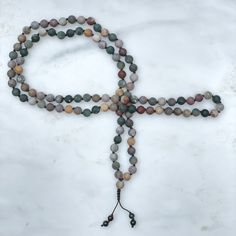 This 108 bead mala features gorgeous matte Indian agate beads. Mala can be worn as a necklace or wrapped as a bracelet. Indian agate beads encourage deep calm and contemplation. Indian agate's energy is said to accelerate change. It is very useful when performing meditation or therapy, as it helps to move more swiftly through the process and focuses on energy to do so. Indian agate is known to hold powerful energy, stimulating the entire aura and speeding up internal and external processes. Meas Bracelet Indian, Beads Mala, Indian Agate, 108 Mala Beads, Powerful Energy, Stone Healing, Rishikesh, 108 Bead, Agate Bracelet