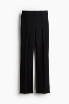 Dress pants in jersey. High waist  concealed  elasticized waistband  and straight legs with stitched creases at front.