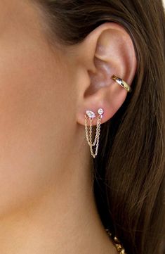 Warm 18-karat gold plates these chain drop earrings that adorn two piercings on each of your lobes with cubic zirconia. Designed for multiple piercings on each ear 1/8"W x 1/8"L studs; 2" length; 1/2" drop 18k-gold plate/cubic zirconia Imported Piercing Chain, Multiple Piercings Earrings, Double Pierced Earrings, Second Hole Earrings, Double Ear Piercings, Double Piercing, Multiple Earrings, Crystal Green, Stacked Earrings