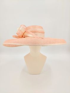 Sinamay hat in pale pink and ivory. Perfect for the Kentucky Derby and weddings. Also available in tan. This hat is more pink in person. Much like the photos with the model. Formal Beige Hat With Flat Brim, Beige Flat Brim Hat For Formal Occasions, Formal Beige Flat Brim Hats, Elegant Pink Sun Hat For Summer, Fitted Cream Wide Brim Costume Hat, Cream Wide Brim Costume Hat, Elegant Pink Summer Sun Hat, Fitted Beige Brimmed Hat, Beige Adjustable Formal Hats