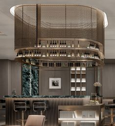 an elegant bar with stools and bottles on the shelves above it in a restaurant