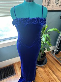 "90s Vintage Soft + Silky Velvet Blue Rosette Spaghetti Strap Maxi Dress **Note: In a couple of photos, the dress appears purple, but it's actually a royal blue shade.** Brand: Morgan & Co.  Size: Medium (Vintage 13-14) Measurements: 36\"chest/bust; 32\" waist; 55.5\" length Features: Neckline is lined with lush velvet blue rosettes, fully lined, polyester and spandex, slits on both sides, spaghetti straps, ankle-length with slits on both sides. Excellent vintage condition with no flaws. Smoke-f Blue Velvet Maxi Dress, Strap Maxi Dress, Blue Velvet Dress, Vintage Ideas, Velvet Maxi Dress, Spaghetti Strap Maxi Dress, Vintage Soft, Maxi Robes, Blue Velvet