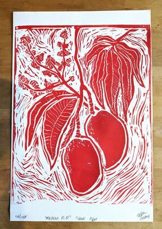 a red and white linoleum print with two pears hanging from a tree branch