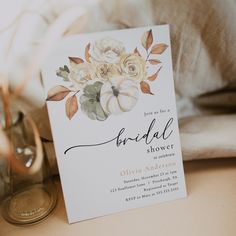 a bridal shower card sitting on top of a table