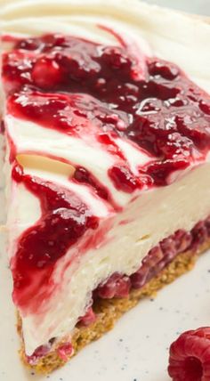 a piece of cheesecake with raspberry sauce on top