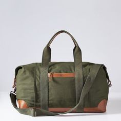 Destined to become your most-used weekender, this best selling travel bag is a Mark & Graham classic. Crafted from soft, durable cotton canvas with warm leather accents, this timeless weekender features a spacious interior with a striped cotton lining, an outside pocket for easy access to small essentials, an adjustable crossbody strap and comfortable carry handles. Add a custom monogram to make it yours.    Small: 24"w x 8"d x 15"h  Large: 31"w x 10.5"d x 17.5"h  Cotton canvas exterior with sad Leather Weekender Bag, Leather Weekender, Sports Bags, Personalized Canvas, Mark And Graham, Embroidered Monogram, Pack Your Bags, Personalised Canvas, Saddle Leather