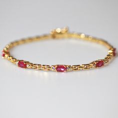 Meideya Jewelry Gold vermeil garnet bracelet with watch strap design Gold Gemstone Bracelet, Bracelet Ideas Gold Women, Ruby Diamond Bracelet, Diamond Bracelet For Women, Gold Bracelet Simple, Women Chain, Black Beaded Jewelry, Gold Rings Fashion, Garnet Bracelet