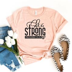 "She Is Strong T-shirt, Christian Shirt, Religious Tee, Faith Top, Daughter Birthday Gift, Women's Shirts, Girl Power Gift, Motivational Tee, Inspirational Shirt, Jesus Top, She Is Strong Shirt, Girl Power, Feminism Shirt, Strong Women Shirt, Strength, Mom Shirt, Spanish Shirt, Mothers Day Shirt, Empower Women, Strong Mom Shirt, Inspirational Shirt, She Is Brave Shirt, Be Kind Tshirt This updated unisex essential fits like a well-loved favorite. Super soft cotton and excellent quality print makes one to fall in love with it over and over again. ------------- Fabrication ------------- 100% Combed ring spun cotton Made by specially treating the cotton fibers before spinning them into yarn. The result is stronger and smoother fabric. ------------- Unisex T-shirt Size Chart ------------- XS - Pink Cotton T-shirt With Lettering, Be Kind Tshirt, Braves Shirts, She Is Strong, Spanish Shirts, Feminism Shirt, Strong Mom, Shirt Girl, Christian Shirt