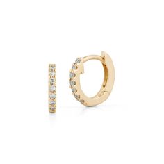 These pavé-set diamond and gold mini huggie earrings are a perfect size for those looking to fill 2nd, 3rd, 4th etc. piercings, or for those with petite earlobes. These diamond huggies hug your earlobe just right and are a brilliant addition to your ear stack. For most people, the mini huggies will fit in your second or third piercing, but some can wear these in their first hole. These diamond huggie earrings are the everyday staple earrings you've been hunting for. They are a favorite of the Da