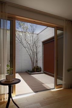 an image of a screen shot of a room with sliding glass doors that open up to the patio