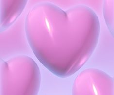 pink hearts floating in the air on a blue and pink background with blurry bubbles