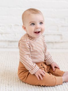 Our super soft and adorable River bodysuit is a mom favorite here at Colored Organics. Buttery soft and breathable, this bodysuit is the comfiest base layer or stand alone piece. Made of 100% organic cotton fabric Nickel-free snaps Water-based dyes ensuring long-lasting color vibrancy and durability Sustainably sourced and ethically produced Naturally hypoallergenic Fitted Organic Cotton Bodysuit For Playtime, Cotton Stretch Bodysuit For Playtime, Organic Cotton Long Sleeve Onesie For Spring, Organic Cotton Fitted Bodysuit For Loungewear, Playful Stretch Cotton Bodysuit, Fitted Organic Cotton Long Sleeve Onesie, Cute Brown Cotton Onesie, Fitted Long Sleeve Organic Cotton Onesie, Cute Cotton Stretch Bodysuit