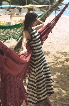 Head out for dinner straight from the pool in this cover-up dress crafted from an openwork crochet with wide stripes and a flowy skirt. Mock neck Sleeveless Unlined 100% acrylic Hand wash, dry flat Made in Peru Hispanic & Latinx Owned/Founded Striped Halter Neck Maxi Dress For Beach, Striped Beachwear Dresses For Beach, Striped Maxi Dress For Beach, Striped Maxi Dress For Beach Season, Striped Beachwear Dress For Beach Season, Bohemian Striped Maxi Dress For Beach Cover-up, Striped Beach Sundress, Bohemian Striped Maxi Dress For Beach, Striped Sundress For Beach