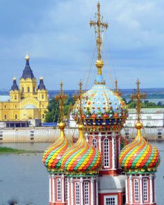 an elaborately painted building in front of a body of water