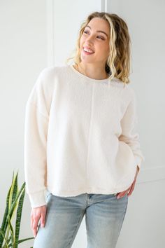 Those chilly days aren't going anywhere anytime soon so make sure to stay cozy in the Fuzzy Cuddles Sweater In Off White! This extra cuddly sweater is shaped from a fuzzy knit, making up a round neckline with drop shoulder long sleeves and a slightly cropped, boxy bodice. Stretchy + Medium Weight Self: 100% Polyester Contrast: 95% Polyester, 5% Spandex Wash cold, hang dry Relaxed fit *Measurements listed below are of the actual clothing item* S: Chest 34" Length 23"M: Chest 36" Length 24"L: Ches