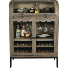 a wooden cabinet filled with bottles and glasses