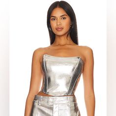 It’s All About The Metallic This Year! Make A Statement In The Tinsley Metallic Faux Leather Top! Nwt Fitted Silver Glamorous Tube Top, Glamorous Fitted Silver Tube Top, Fitted Glamorous Bandeau Top, Glamorous Fitted Bandeau Top, Silver Party Tube Top, Metallic Tube Top For Night Out, Chic Fitted Metallic Crop Top, Metallic Fitted Tube Top For Night Out, Silver Cropped Fitted Top