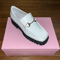 Intentionally Blank White Leather Upper & Black Sole Style: Hk2 Loafers Croc Embossed Lug Sole Size: Women’s Size 5 Leather Croc Embossed Heavy Lugged Sole Memory Foam Cushioning 1.5” Heel 1” Platform Leather Upper & Lining Synthetic Sole Imported New In The Box Smoke & Pet Free Home Shipping Daily: Monday - Friday Bundle Your Likes For A Private Offer Please Ask Questions White Platform Loafers With Lug Sole For Work, White Synthetic Slip-on Platform Loafers, Formal White Loafers With Lug Sole, Trendy Formal Platform Loafers With Textured Sole, Trendy White Leather Platform Loafers, White Office Loafers With Lug Sole, White Leather Platform Loafers With Lug Sole, White Leather Loafers With Lug Sole, Chic Office Platform Loafers With Textured Sole