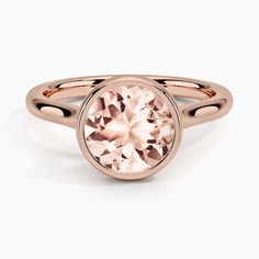 a rose gold ring with an oval cut stone