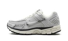 The Nike Zoom Vomero 5 “Chrome” is a mostly grey-based colorway of the retro running shoe.  The Zoom Vomero 5 was first released in 2010 as a performance sneaker before becoming a lifestyle option as part of the Y2K sneaker trend.  On the “Chrome” colorway, the shoe features a Photon Dust mesh construction with grey and Chrome overlays.  A flashy Chrome Swoosh can be found on the sides.  “Nike Vomero 5” branding appears on the tongue.  A Zoom Air cushioning unit within the Sail-colored foam midsole provides all-day comfort. Chrome Shoes, Nike Zoom Vomero 5, Nike Vomero, Zoom Vomero 5, Retro Running Shoes, Vomero 5, Sneaker Trend, Black Converse, Stadium Goods