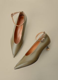 'Je la connais' Tours shoes in Olive green are pointed toe shape with detailed design on the front of the upper. The strap of the shoes is flexible. Tonal stacked leather heel. Leather and rubber outsole in beige.  Details: * Composition - Upper: Cow Leather - Lining: Pigskin, kip - Sole: Leather, Rubber *Heel Height: Shoes With Straps, 2025 Wedding, Parisienne Chic, Shoes Heels Classy, Classy Shoes, Heels Classy, Green Fits, Elegant Shoes, Green Shoes