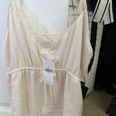 Brand New Never Worn. Slight Crop Feminine Cream Tank Top For Spring, Feminine Cream Camisole For Spring, Feminine Beige Camisole For Spring, Casual Cream Camisole For Spring, Cream Camisole For Spring Daywear, Spring Cream Camisole For Daywear, 2024 Fits, American Eagle Top, White Tops