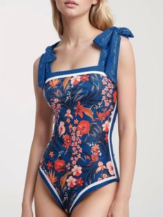 If you are a girl who loves to always be in fashion, even on those summer days, where we like to go to the beach. You can't stop carrying a swimsuit of the latest trends in your suitcase. This beautiful reversible one piece swimsuit is impressive, floral romantic printed. It has a high-cut, many ways to wear and tied gives to you different looks. It is made in a soft 82% polyester and 18% elastane. You will get an ultra chic look if you have a beach event. Adjustable shoulder straps bathing suit. Tied. Color may be lighter or darker depending of the device it is displayed. Trendy Swimwear With Adjustable Straps For Sunbathing, Trendy Printed One-piece Swimwear, Chic Printed Sleeveless Swimwear, Tropical One-piece Swimwear For Spring, Trendy Tropical Print Swimwear For Vacation, Chic Tankini For Spring Beach Party, Chic Swimwear With Adjustable Straps For Vacation, Trendy Sleeveless One Piece For Pool, Trendy Sleeveless One-piece For Pool