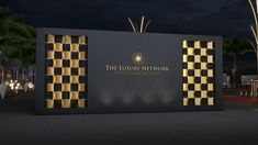 the luxury network sign is lit up at night