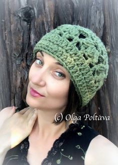 a woman wearing a green crocheted hat