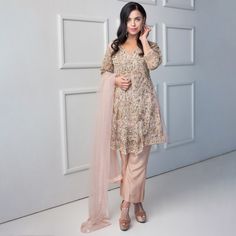 Model: 168 cm and 52 kg size M Burst of peachy and rose hues accents, an outfit fit for a princess, ready to take any occasion by storm. A trendy frock loaded with pearl embellishments and filled with unique middle eastern work of kora, cut dana and naqshi. Not leaving any space on sleeves either; is filled with glorious eye-catching florals and motifs, with small florals scattered with sequins glittering like stars at the back. The retro feel of the bell bottoms made with highest quality regal pure silk fabric. Stand out in these trend-setting design of the season. Top: Color: Light peach Fabric: Net Short frock Frock contains loaded embelishment all over Work includes: kora, pearls, cut dana, naqshi and stones V-neck Back contains silk edge finish and stone floral spray scattered all ove Anarkali Palazzo Set With Naqshi For Reception, Elegant Party Lehenga With Naqshi Details, Pink Naqshi Lehenga, Floor-length Naqshi Sharara For Reception, Bollywood Style Sharara With Naqshi For Reception, Georgette Anarkali Set With Naqshi For Reception, Naqshi Georgette Anarkali Set For Reception, Anarkali Style Party Lehenga With Naqshi Details, Semi-stitched Naqshi Lehenga For Party