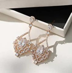 Luxurious Chandelier Gauges - Weddings Earrings - Dangle Plugs - Crystal Zircon ROSE GOLD Bridal Tunnels 6g 4g 2g 0g 4mm 5mm 6mm 8mm 1.65 inches(4.2 cm) long,  0.71 inches(1.8 cm)wide SIZES available: 8g - 3mm 6g - 4mm 4g - 5mm 2g - 6mm 0g - 8mm Regular Posts STYLE gauges: Regular Posts Acrylic Double Flared (Saddle Plugs) Stainless Steel Tunnels  (Internally Threaded) Wood Double Flared (Saddle Plugs) Notices: Please read my shop policies here: https://www.etsy.com/shop/PlugParlour?ref=seller-p Earrings Gauges, Wedding Plugs, Gauges Earrings, Dangle Gauges, Stretched Ear Lobes, Stretched Ear, Dangle Plugs, Plug Earrings, Rose Gold Bridal