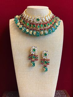 Kundan necklace choker . Premium quality uncut kundan work , semi precious stone setting with crystal drops . Kundan worked tumble bead work. Comes with matching earring. Festive Emerald Kundan Necklace With Stone Work, Festive Emerald Necklace With Kundan Stone Work, Festive Emerald Kundan Necklace, Festive Emerald Jewelry Sets With Stone Work, Emerald Bridal Necklace With Stone Work For Festive Occasions, Festive Bridal Necklace With Emerald Stone Work, Green Jeweled Kundan Necklace For Festivals, Festive Heavy Kundan Emerald Necklace, Traditional Green Jeweled Kundan Necklace