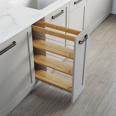 an open cabinet in the middle of a kitchen