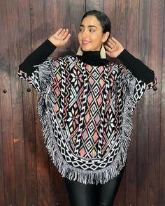 This gorgeous Mexican Artisanal Poncho is perfect for the cold months ahead! The multicolor Fair Isla design adds that perfect pop of color and style to your wardrobe. This poncho is knit, has open sides and it comes in one size so anyone ranging from size Small to 2x will be able to wear it. forrado por dentro, lo que hace ideal para climas muy frios. Black Bohemian Poncho With Batwing Sleeves, White Festival Poncho, Long Sleeve Poncho For Winter Festivals, Multicolor Acrylic Outerwear For Winter, Multicolor Acrylic Winter Outerwear, Black Shawl Poncho One Size, Winter Long Sleeve Festival Cape, One-size Winter Festival Cape, One Size Winter Festival Tops