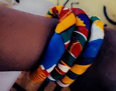 "Handcrafted with Ankara African Print fabrics these Bangles will really add colors & identity to your outfit.  Colorful and trendy accessories  Must have in all seasons  Perfect as a gift for kids & adults  Adults and kids sizes available  Diameter externally 3\"( can be custom made)  Selling by two Bangles  We have different colors available &/or ready to be shipped in 1 or 2 days Tell us your favorite color and we will show you the fabrics available.  It is not guaranteed that we have the sam Handmade Fun Bracelet, Multicolor Bracelets For Crafting, African Pillow, African Print Dress, Ankara Dress, African Print Fabric, Indigo Dye, Fabric Jewelry, 1 Or 2