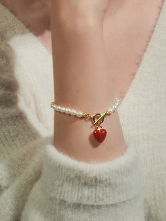 Editor's NotesENGBROX's jewelry is gorgeous and perfect for everyday wear.- Light-weighted- Eye-catching heart pendant detail- Pearl chain band- T-bar closure- Perfect for layering- Minimal and feminine stylesMeasurements(in.)- Size: 5.91in. (L)- Heart: 0.47in.- Toggle: 0.35in. outer diameter- Weight: 0.39oz.Composition & Care- Brass  Epoxy  Freshwater Pearl- Avoid direct heat and moisture- Professional cleaning is recommendedDesigner- by ENGBROX Gift Pearl Bracelet With Heart Beads, Metal Bracelets With Heart Beads, Elegant Everyday Jewelry With Heart Beads, Heart-shaped Pearl Charm Bracelet For Gifts, Adjustable Pearl Bracelet With Heart Beads, Adjustable Heart Beads Pearl Bracelet, Trendy Heart-shaped Jewelry With Lobster Clasp, Heart-shaped Pearl Bracelet For Gift, Heart-shaped Pearl Bracelet Gift