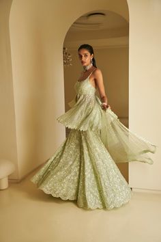 This sharara set features all-over delicate sequin embroidery on a mint green net base. The outfit is paired with a full embroidered peplum top and a matching dupatta.From Seema Gujral's Fiori - the sharara edit collection. DELIVERY TIMEPlease allow 8-12 weeks for your outfit to arrive. FABRIC DETAILSNet Professional cleaning only. Green Indian Outfit, Sequin Sharara, Indian Wedding Guest Outfit, Green Sharara, Indian Fits, Suits Ideas, Diwali Outfit, Peter Kavinsky, Wedding Fits